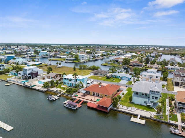 aerial perspective of suburban area featuring a large body of water