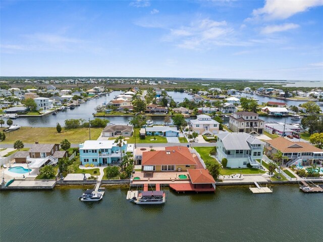 aerial view of residential area with a nearby body of water