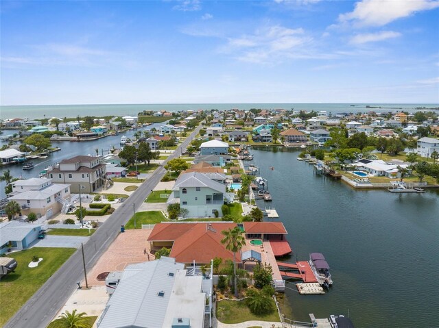 aerial perspective of suburban area featuring a nearby body of water