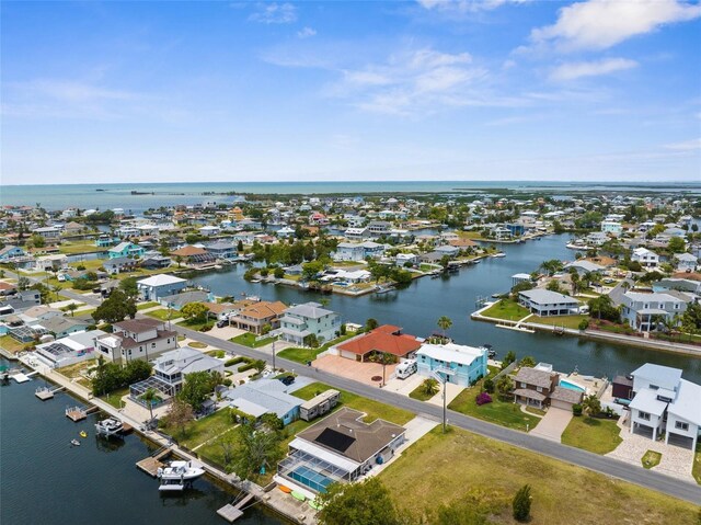 aerial perspective of suburban area featuring a large body of water