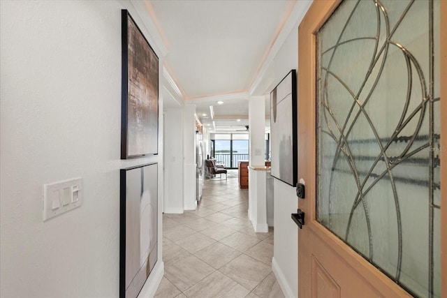 4550 Bay Blvd Unit 1231, Port Richey, FL 34668 - hall featuring light tile patterned floors and crown molding