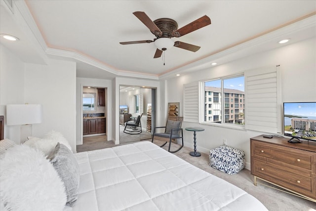 4550 Bay Blvd Unit 1231, Port Richey, FL 34668 - carpeted bedroom featuring a raised ceiling, recessed lighting, ensuite bath, a ceiling fan, and crown molding