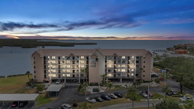 4550 Bay Blvd Unit 1231, Port Richey, FL 34668 - property at dusk with a water view and a view of apartment building / complex