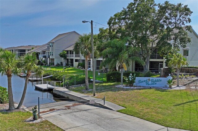 4550 Bay Blvd Unit 1231, Port Richey, FL 34668 - view of home's community featuring a boat ramp, a water view, a lawn, a dock, and a residential view