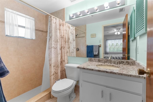 bathroom featuring toilet, visible vents, tiled shower, vanity, and connected bathroom