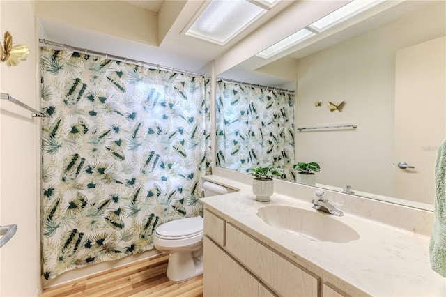 full bathroom with toilet, curtained shower, vanity, and wood finished floors