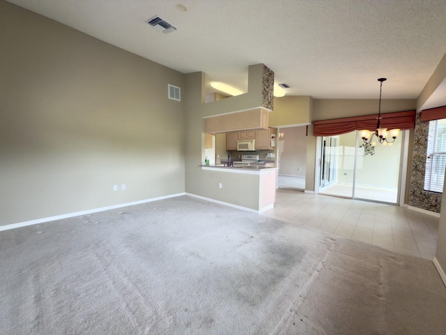 unfurnished living room featuring vaulted ceiling, a chandelier, light carpet, and baseboards