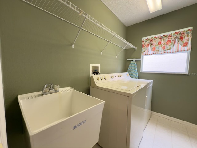 washroom featuring independent washer and dryer and baseboards