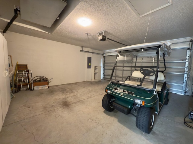 garage featuring electric panel and a garage door opener