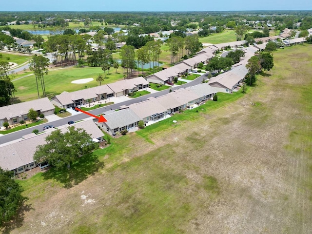 view of property location featuring a nearby body of water and nearby suburban area