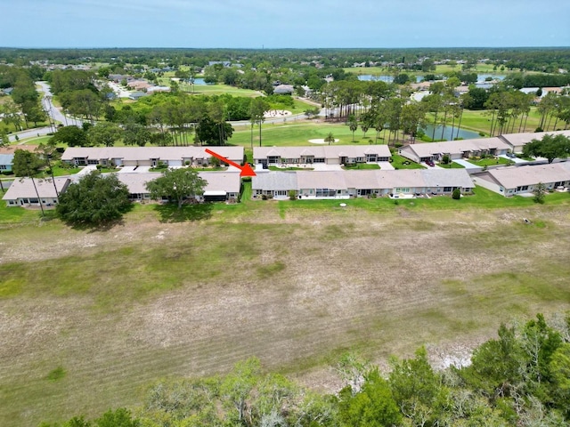 aerial view of residential area with a large body of water