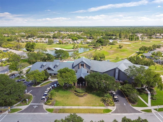 aerial perspective of suburban area with a nearby body of water and a golf club