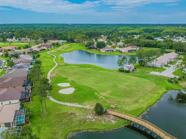 aerial perspective of suburban area with a nearby body of water and a golf club