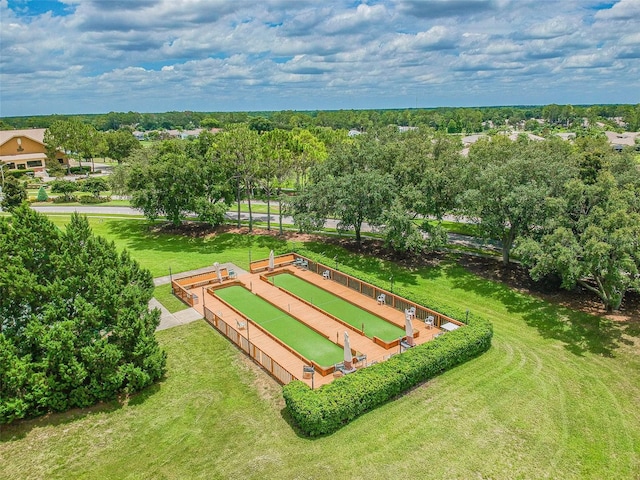 drone / aerial view of a tree filled landscape