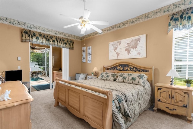 11443 Marsh Creek Ct, New Port Richey, FL 34654 - bedroom featuring light carpet, access to outside, and a ceiling fan