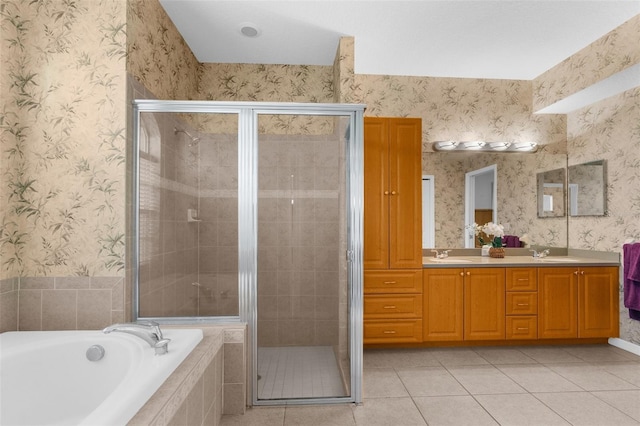11443 Marsh Creek Ct, New Port Richey, FL 34654 - full bathroom with a shower stall, a garden tub, tile patterned flooring, double vanity, and wallpapered walls
