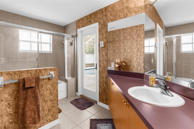 11443 Marsh Creek Ct, New Port Richey, FL 34654 - full bathroom with a tile shower, tile patterned flooring, vanity, and a bath