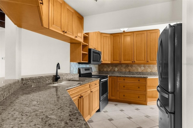 6321 Garland Ct, New Port Richey, FL 34652 - kitchen featuring stainless steel appliances, a sink, open shelves, light stone counters, and decorative backsplash
