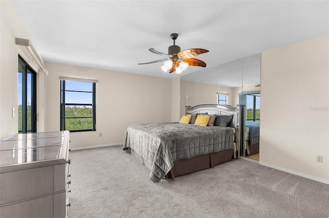 6321 Garland Ct, New Port Richey, FL 34652 - bedroom with carpet floors, baseboards, and ceiling fan
