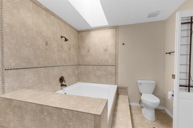 6321 Garland Ct, New Port Richey, FL 34652 - bathroom featuring tile patterned flooring, tiled bath, toilet, tiled shower, and a skylight