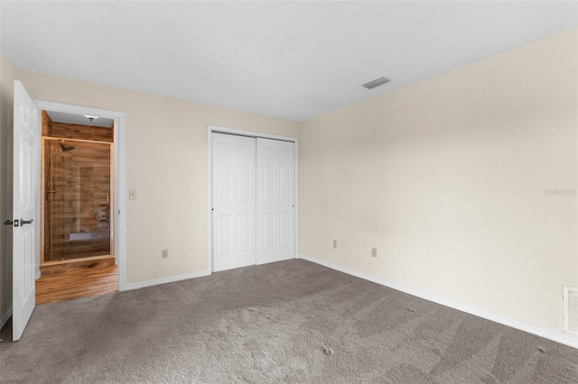 6321 Garland Ct, New Port Richey, FL 34652 - unfurnished bedroom featuring carpet flooring, baseboards, and a closet