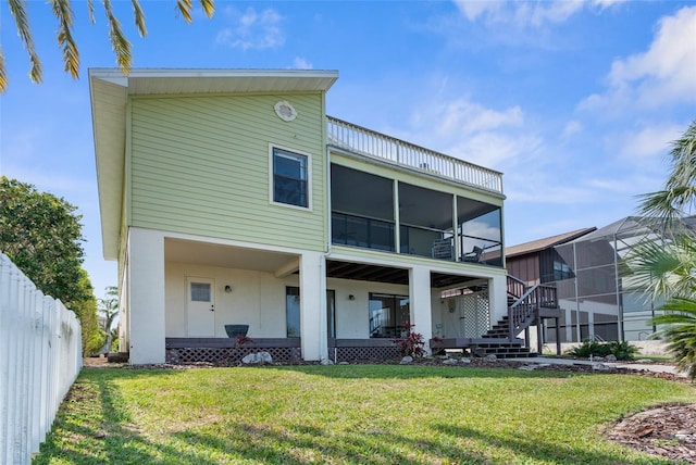 6321 Garland Ct, New Port Richey, FL 34652 - rear view of house featuring a sunroom and stairway