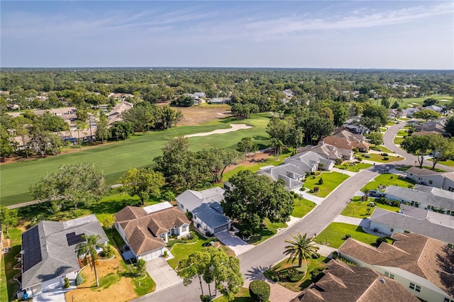 aerial view of residential area featuring a golf course
