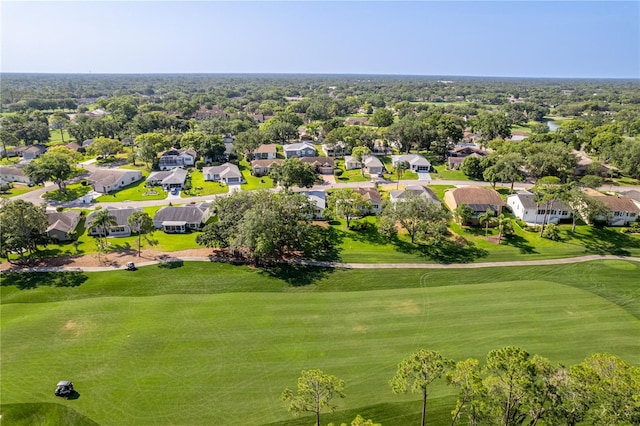 aerial view of residential area with a local golf course