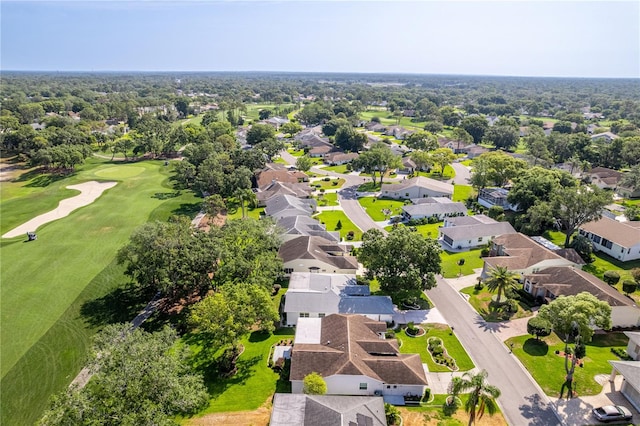aerial view of residential area with a local golf course