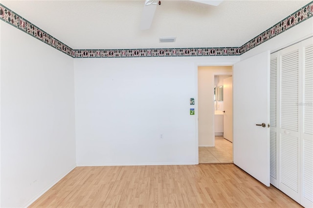 empty room with wood finished floors and baseboards