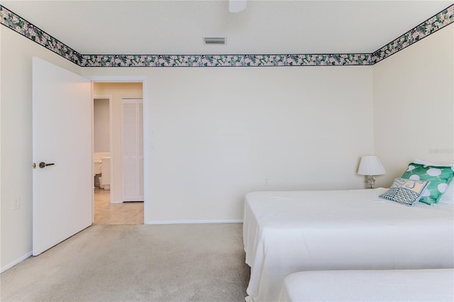 carpeted bedroom with baseboards and a ceiling fan