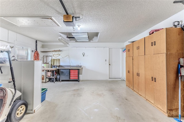 garage with a garage door opener and water heater
