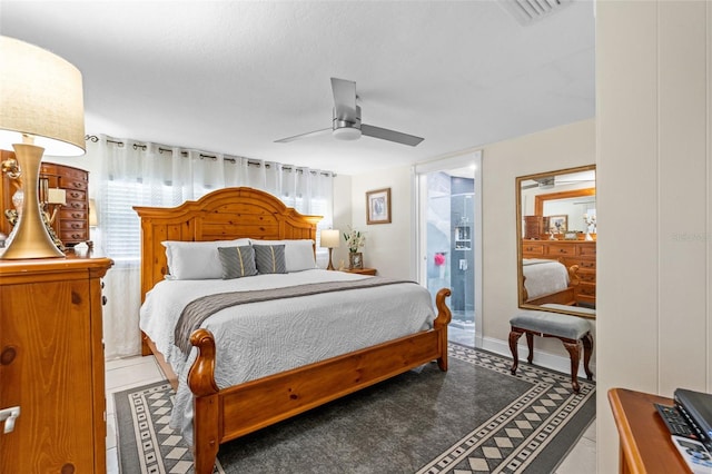 bedroom featuring a ceiling fan and tile patterned floors