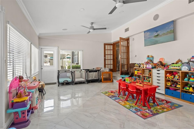 rec room featuring crown molding, a ceiling fan, and marble finish floors