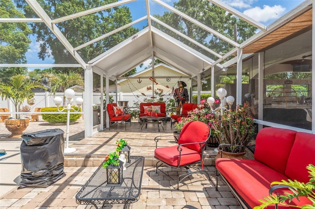 sunroom featuring outdoor lounge area and vaulted ceiling
