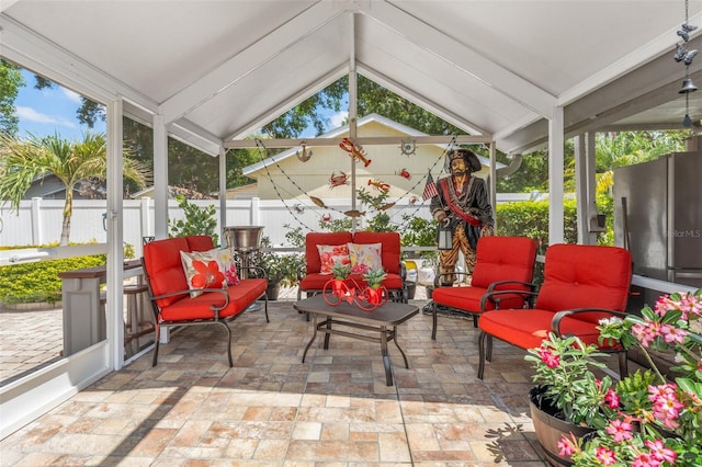 sunroom / solarium featuring outdoor lounge area and healthy amount of natural light