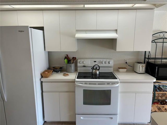 kitchen featuring white appliances, under cabinet range hood, light countertops, and white cabinetry