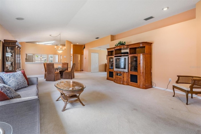 1053 Winding Willow Dr, Trinity, FL 34655 - living room with lofted ceiling, carpet floors, a chandelier, and baseboards
