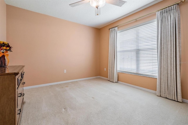 1053 Winding Willow Dr, Trinity, FL 34655 - empty room with ceiling fan, light colored carpet, and baseboards