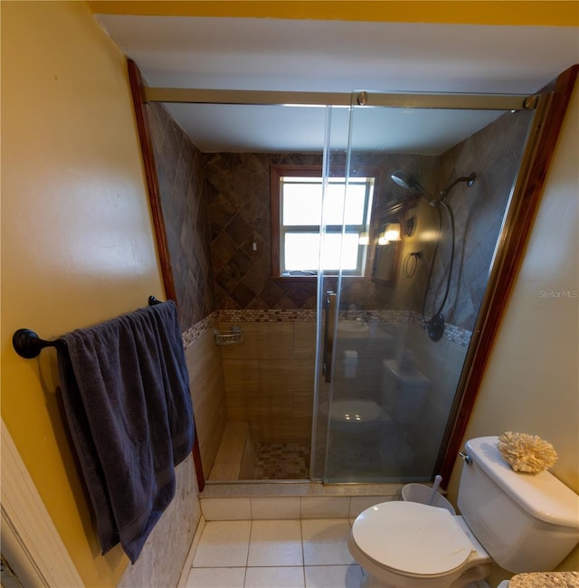 8126 Wooden Dr, Spring Hill, FL 34606 - full bath with toilet, a shower stall, and tile patterned flooring