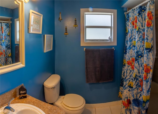 8126 Wooden Dr, Spring Hill, FL 34606 - bathroom with toilet, a shower with shower curtain, vanity, tile patterned floors, and baseboards