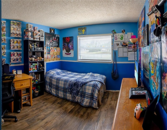 8126 Wooden Dr, Spring Hill, FL 34606 - bedroom with a textured ceiling and wood finished floors