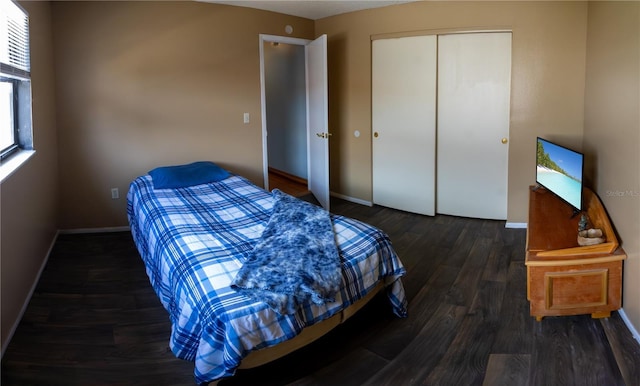 8126 Wooden Dr, Spring Hill, FL 34606 - bedroom with baseboards, a closet, and wood finished floors