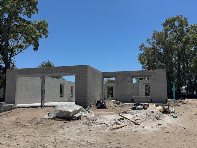 7583 St Andrews Blvd, Weeki Wachee, FL 34613 - rear view of house featuring concrete block siding