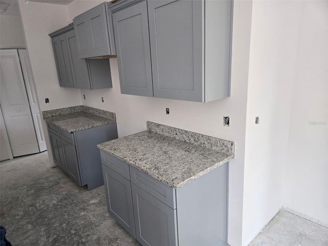 7583 St Andrews Blvd, Weeki Wachee, FL 34613 - kitchen featuring gray cabinetry