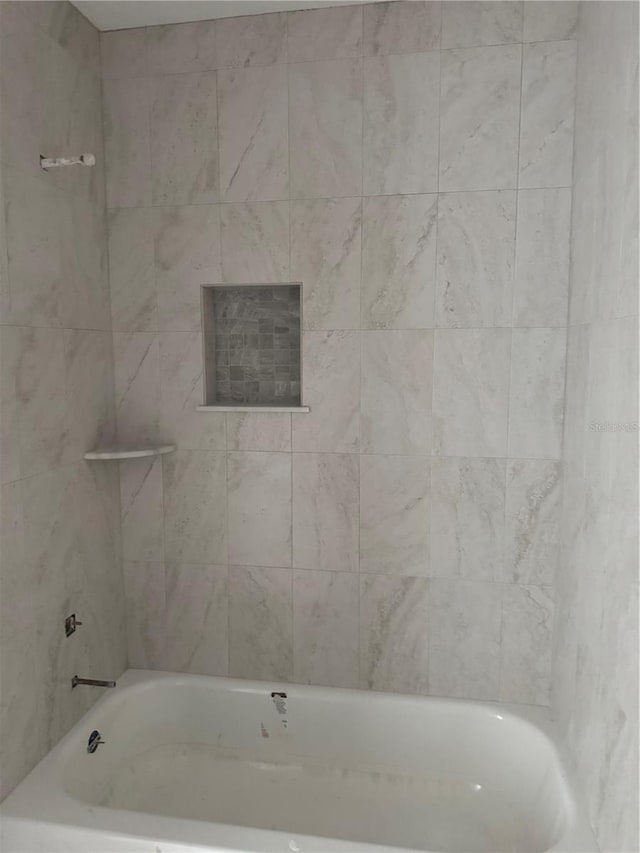 7583 St Andrews Blvd, Weeki Wachee, FL 34613 - bathroom featuring a bathtub and a shower