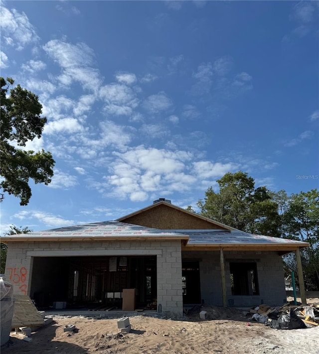 7583 St Andrews Blvd, Weeki Wachee, FL 34613 - property in mid-construction with an attached garage and concrete block siding