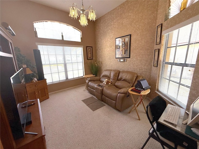 9311 Haas Dr, Hudson, FL 34669 - living area featuring carpet flooring, a chandelier, a high ceiling, and baseboards