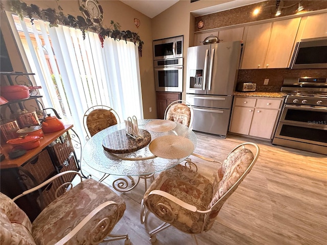 9311 Haas Dr, Hudson, FL 34669 - dining room featuring light wood-style floors