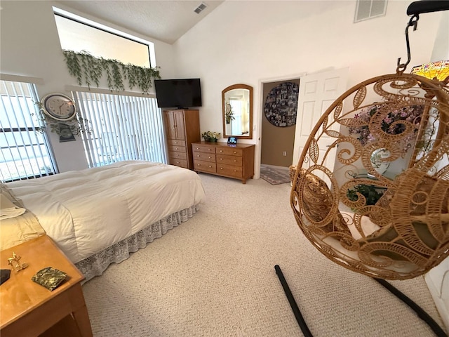 9311 Haas Dr, Hudson, FL 34669 - bedroom featuring light carpet, high vaulted ceiling, and baseboards